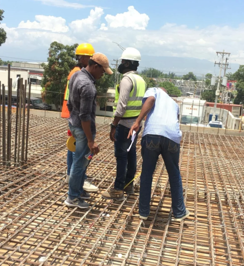 Construction jobsite with workers and supplies